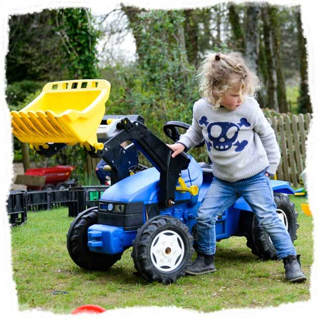 Having fun playing with a ride on digger